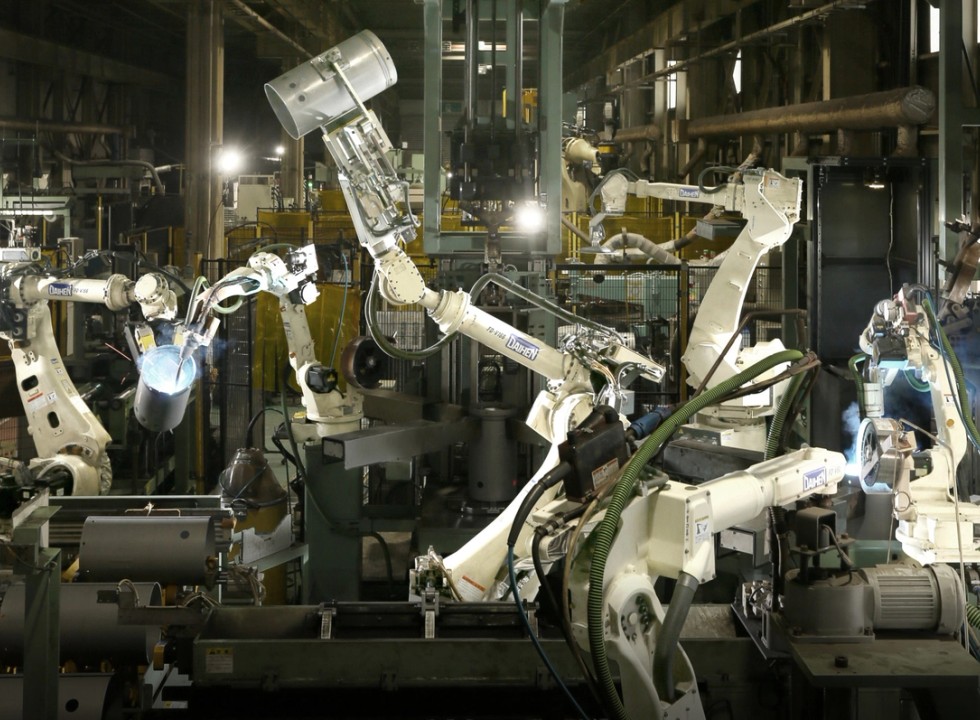 OTC Daihen robotic welding automation cell in an industrial workshop