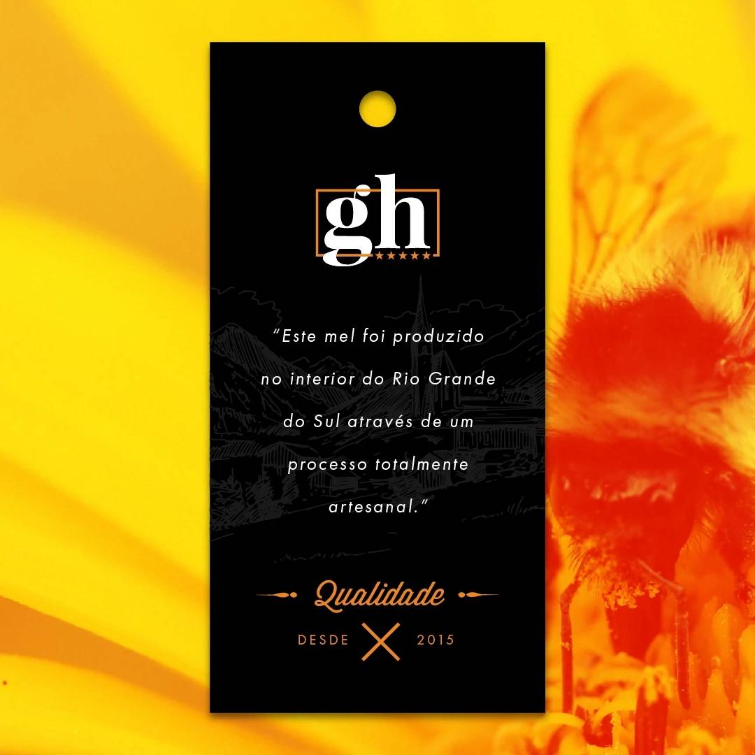 Black GutesHaus product tag with white and gold typography over an orange flower.