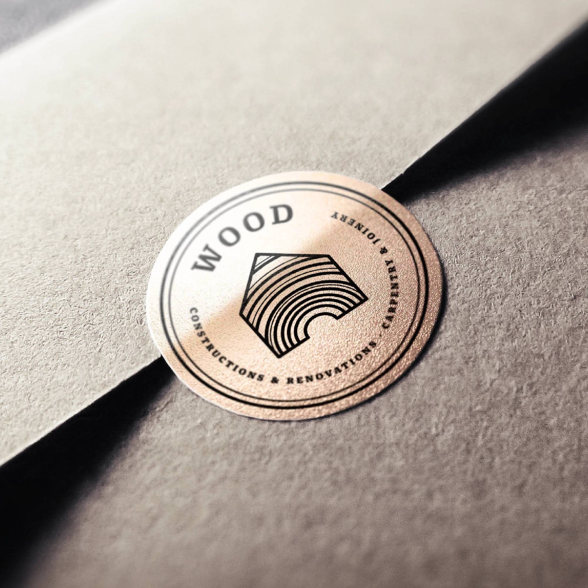 Wood Carpentry and Joinery circular seal printed on a textured gray envelope.