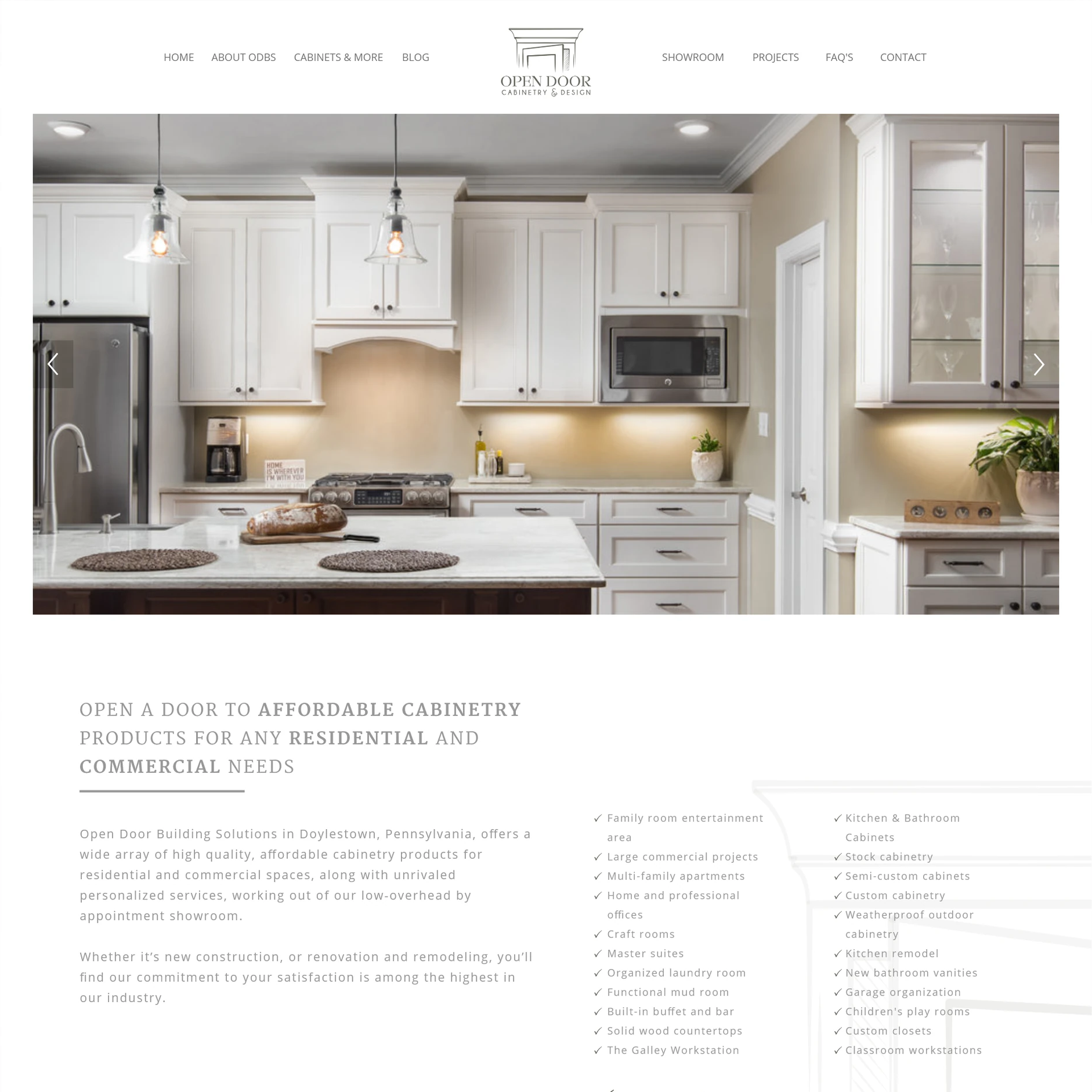 Open Door Cabinetry and Design homepage with a bright kitchen photograph and service introduction.