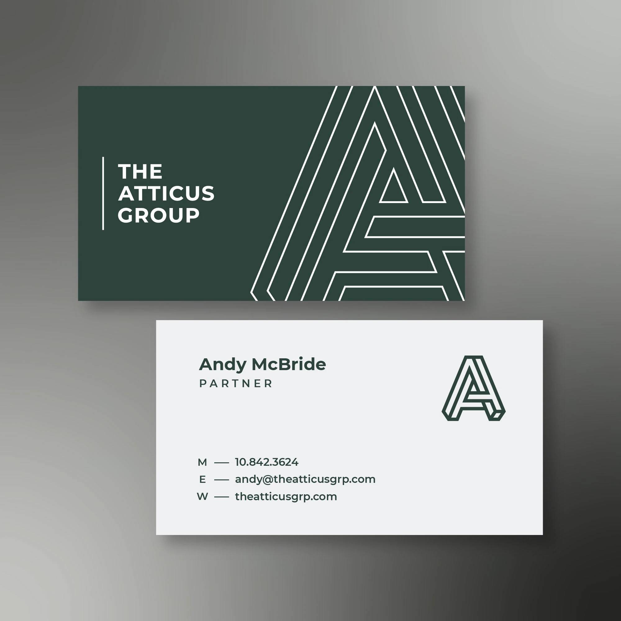The Atticus Group business card pair with green geometric typography and contact details.