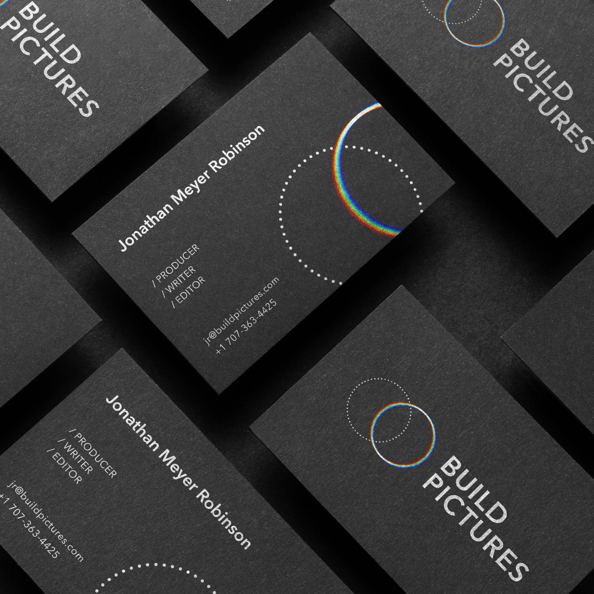 Build Pictures business cards with white typography and overlapping circular graphics.