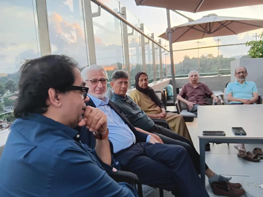 Sharing Subud stories in Kandy. Lakshman, Hamid, Mustafa, Zareefa, her husband Hussain and Malik.