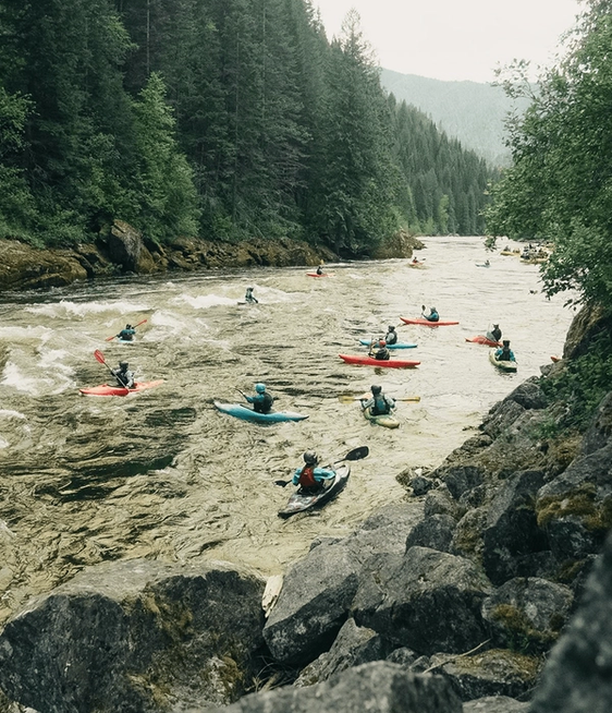 kayakers going down a river