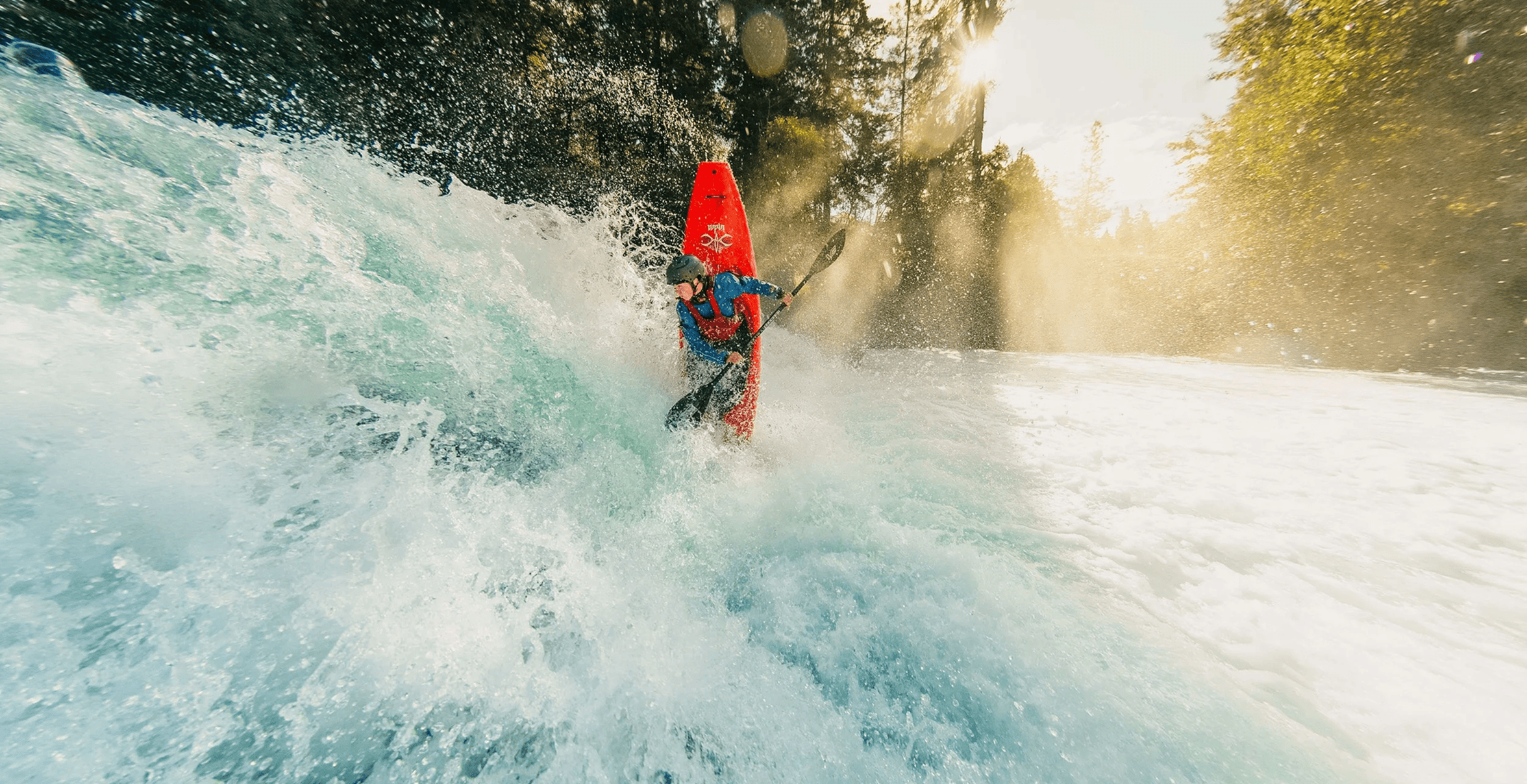 kayaker paddling down river