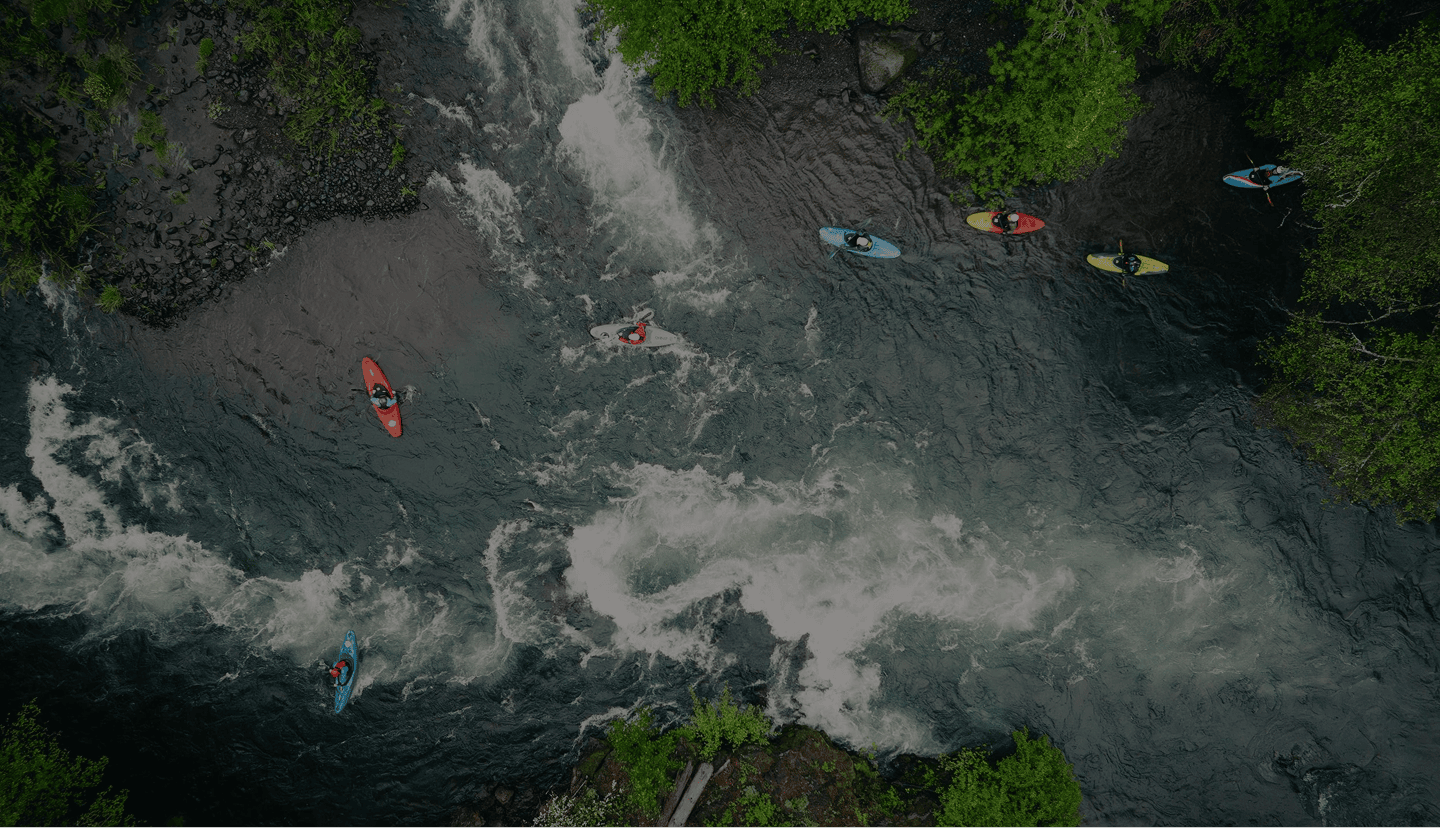 Kayakers floating down a river