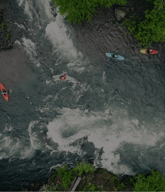 Kayakers floating down a river