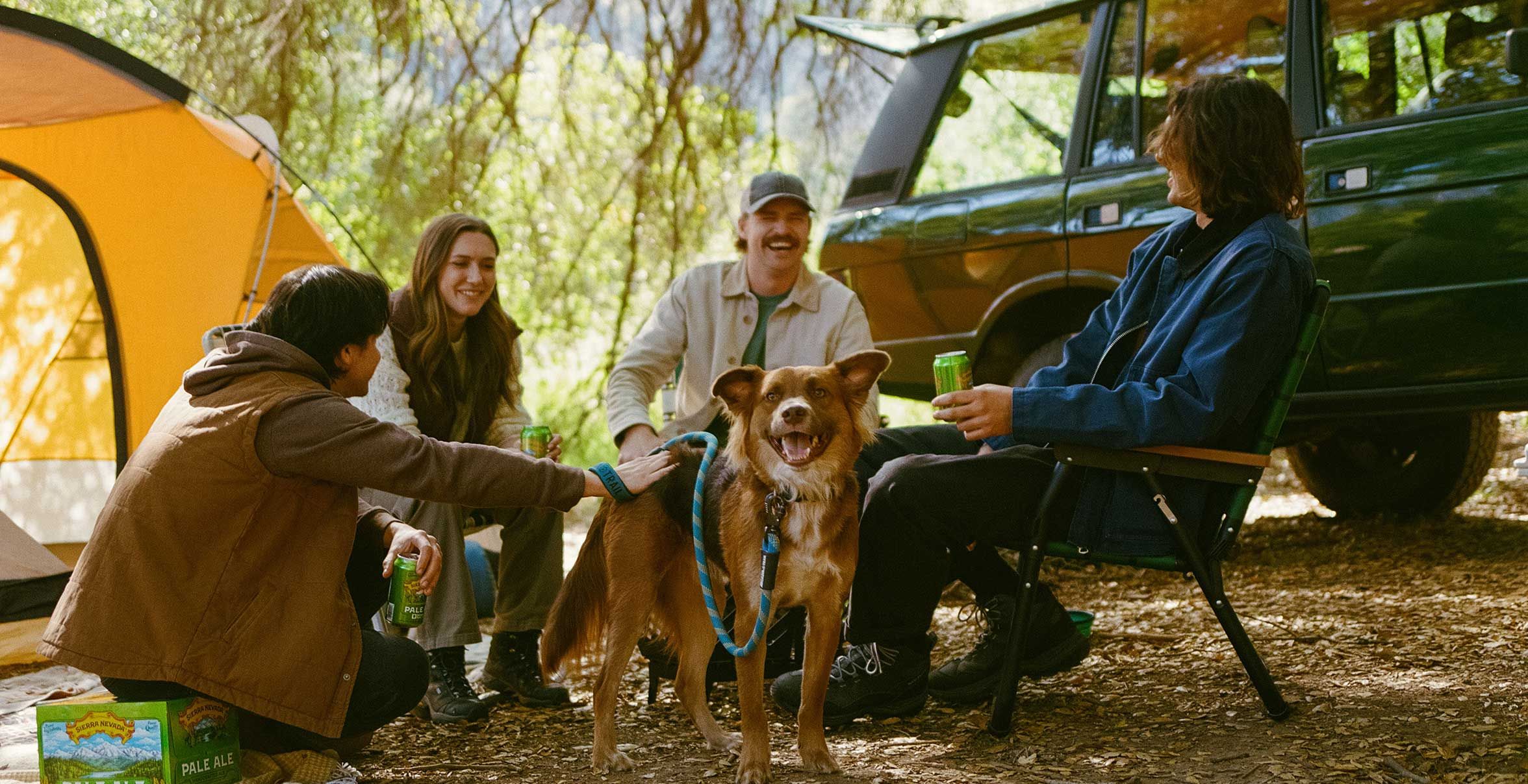 friends enjoying sierra nevada beer while camping