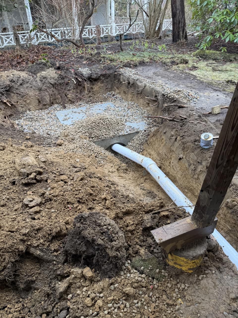 Crushed-stone drainage pit installed to redirect roof and surface runoff away from the home Legacy Excavation is a drainage contractor that provides engineered storm-water and drainage systems in Plymouth, MA