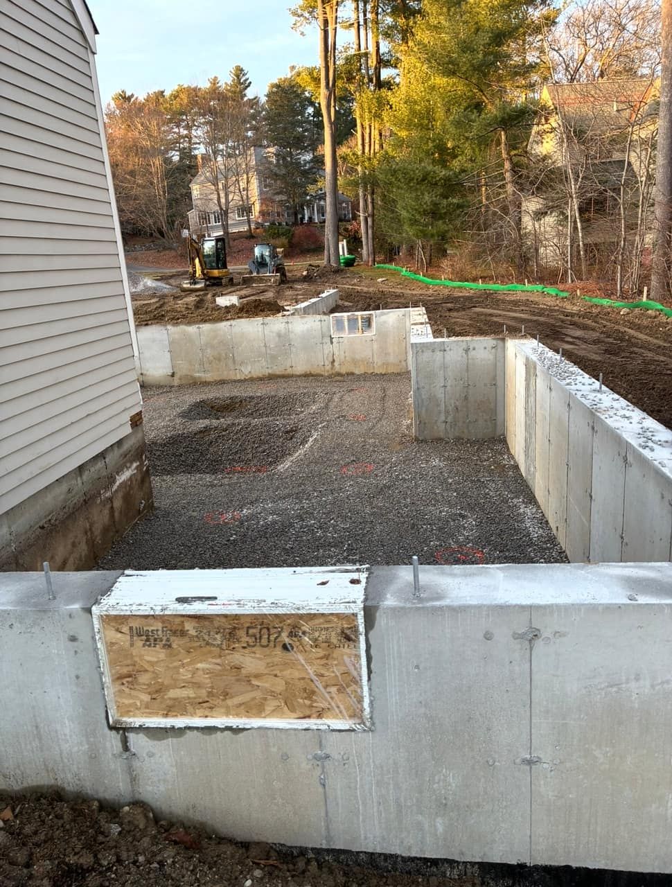 Interior floor grading finished to tolerance and ready for concrete Legacy Excavation is an excavation company that provides laser-graded pads and slab prep in Plymouth, MA