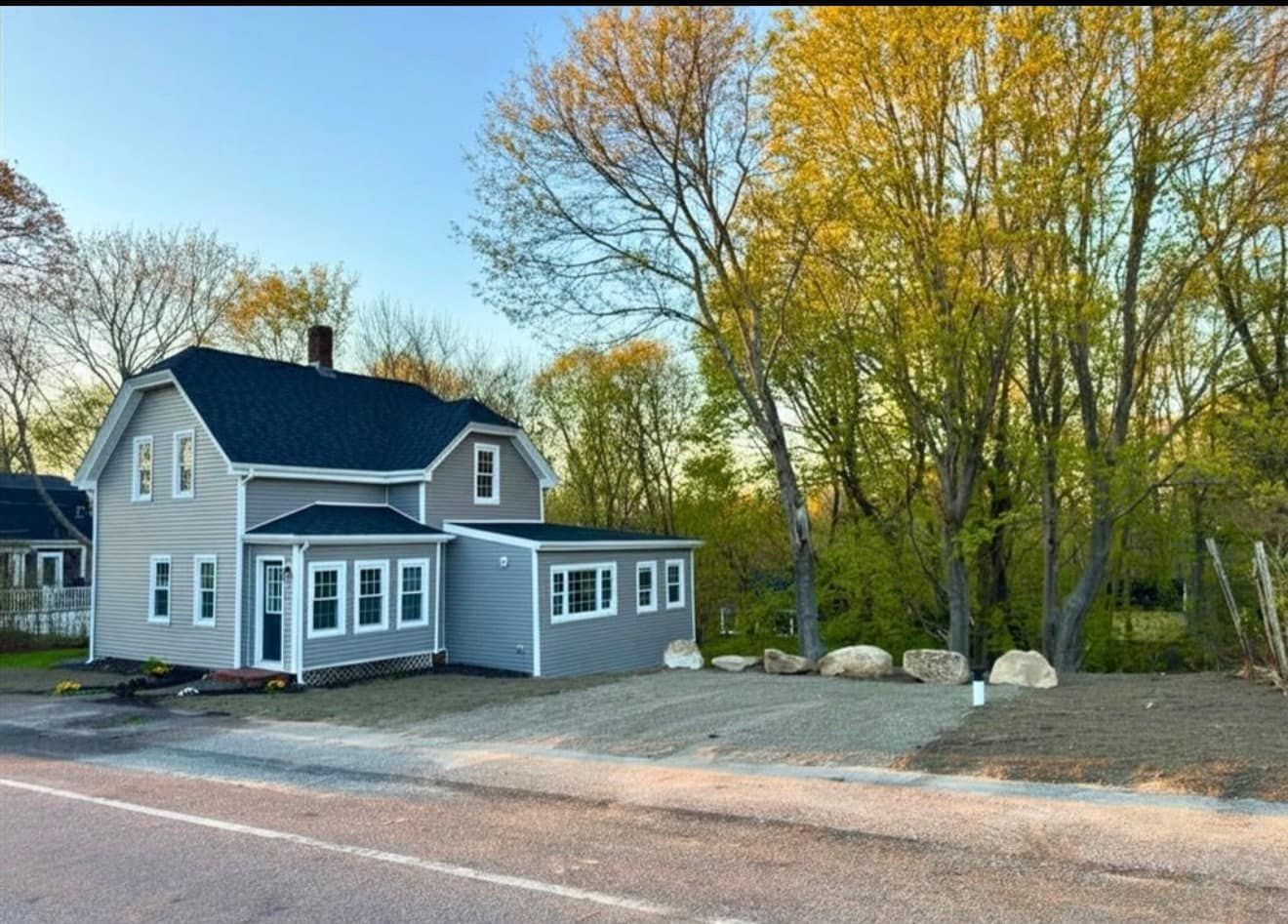Gravel driveway restored after a completed septic system installation Legacy Excavation is an excavation contractor that provides septic installation with lawn restoration for Southeastern MA homeowners