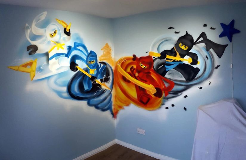 Lego Ninjago ninjas graffiti mural painted across the corner of a child’s bedroom, custom kids’ room wall art by Thomas Palaniuk