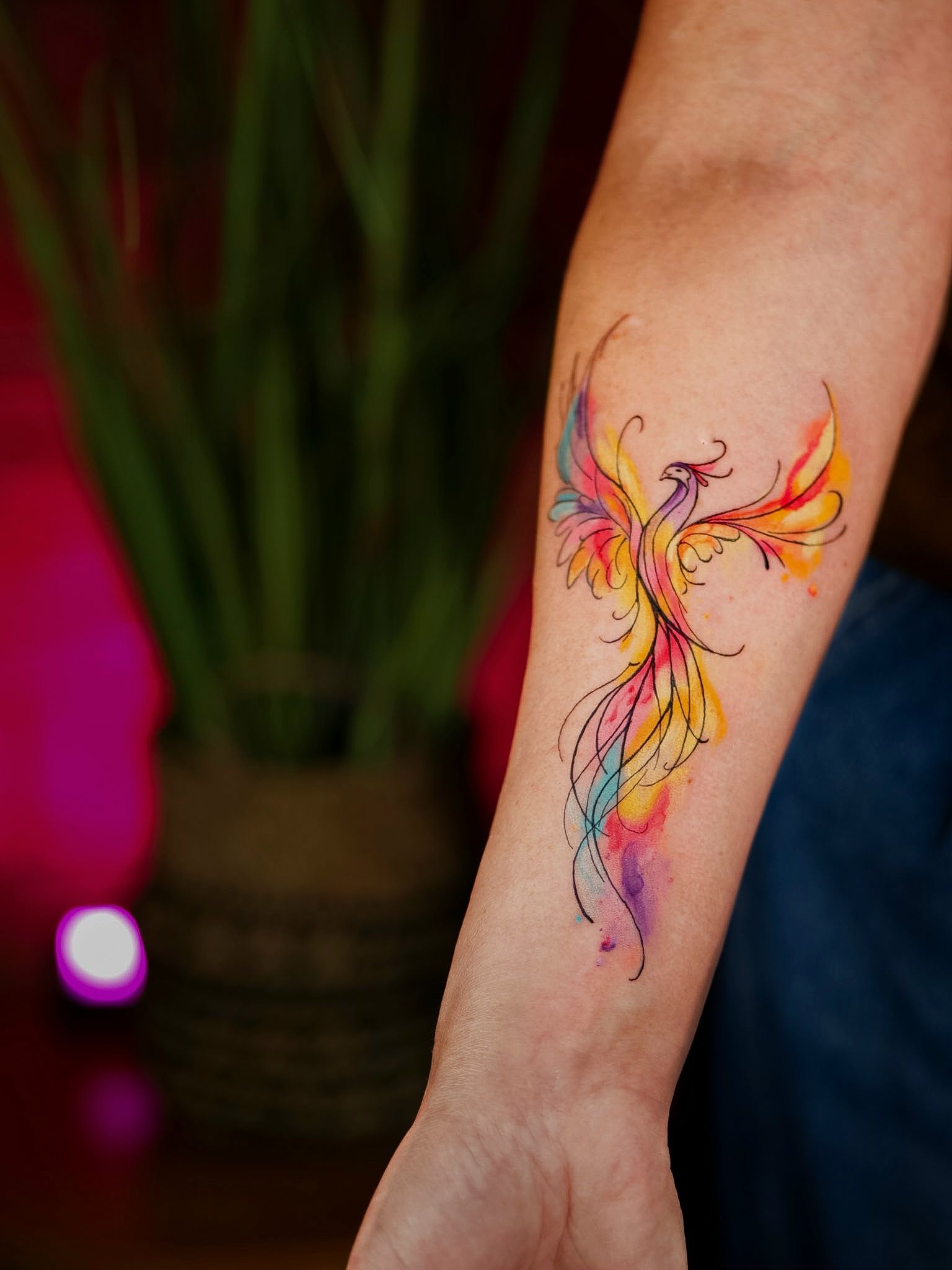 Watercolour phoenix forearm tattoo, by Thomas Palaniuk, Aloha Tattoo Studio Gloucester
