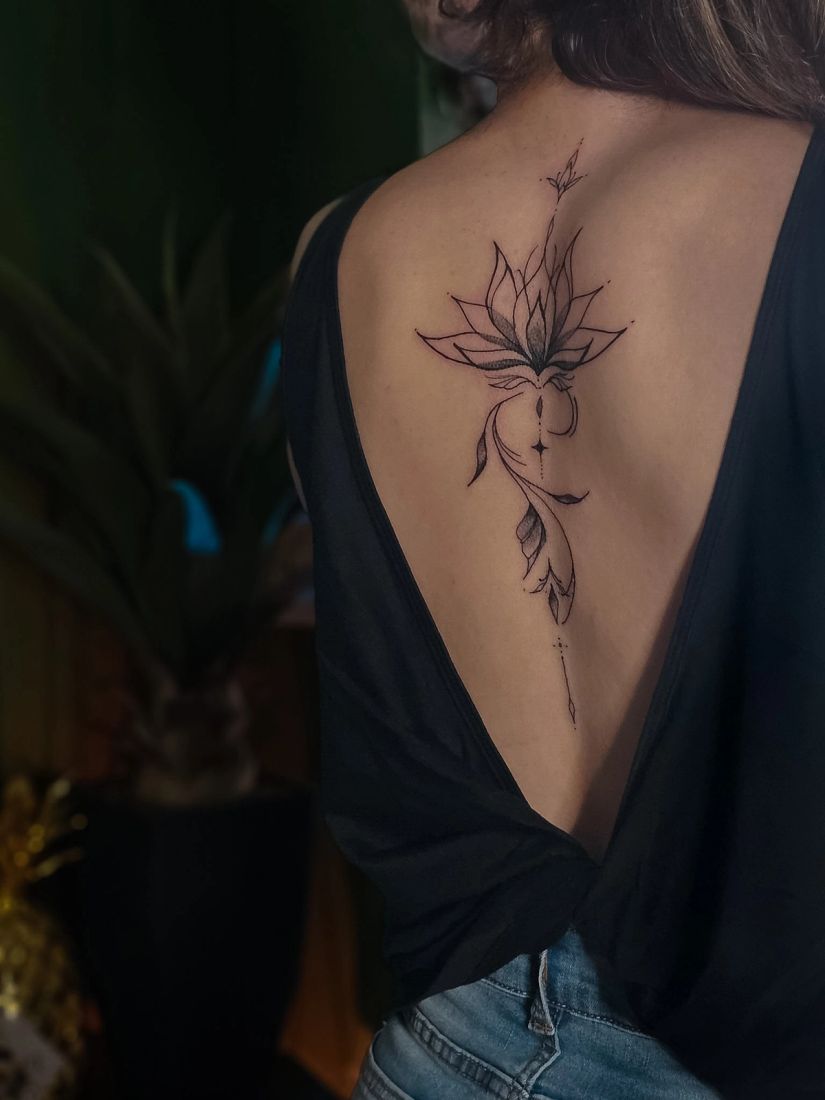 Fine line lotus spine tattoo, by Thomas Palaniuk, Aloha Tattoo Studio Gloucester