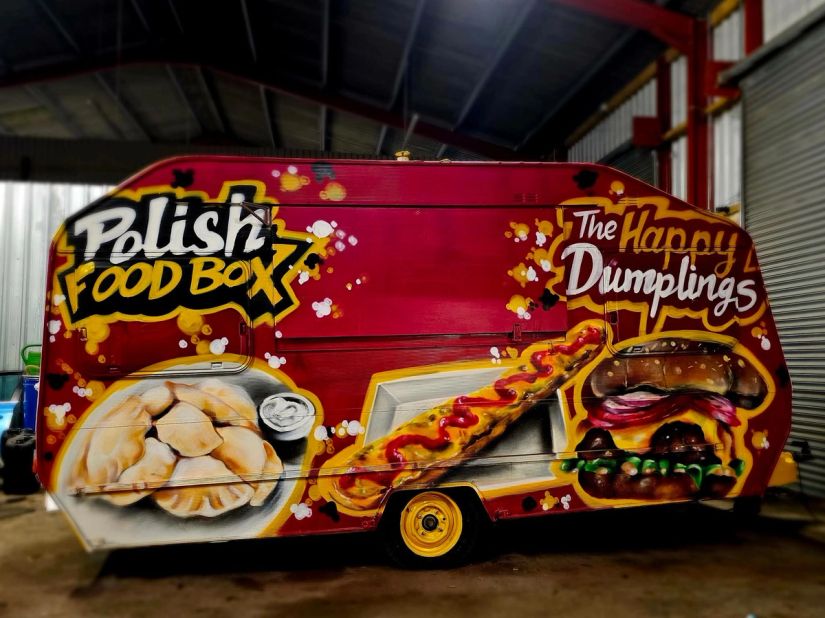 Polish Food Box catering trailer hand-painted with dumplings, hot dog and burger graffiti artwork by Thomas Palaniuk