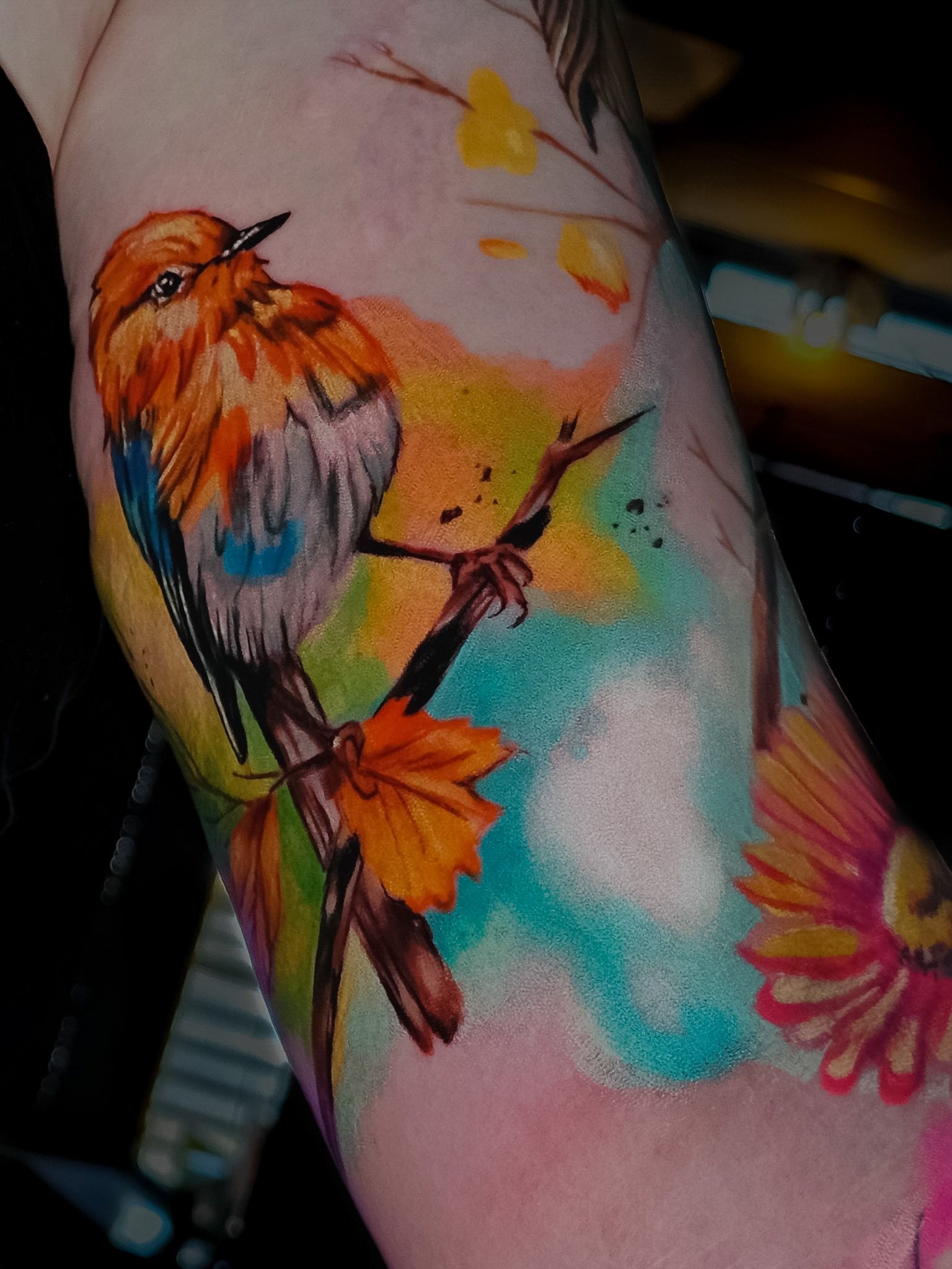 Watercolour bird and flowers tattoo, by Thomas Palaniuk, Aloha Tattoo Studio Gloucester
