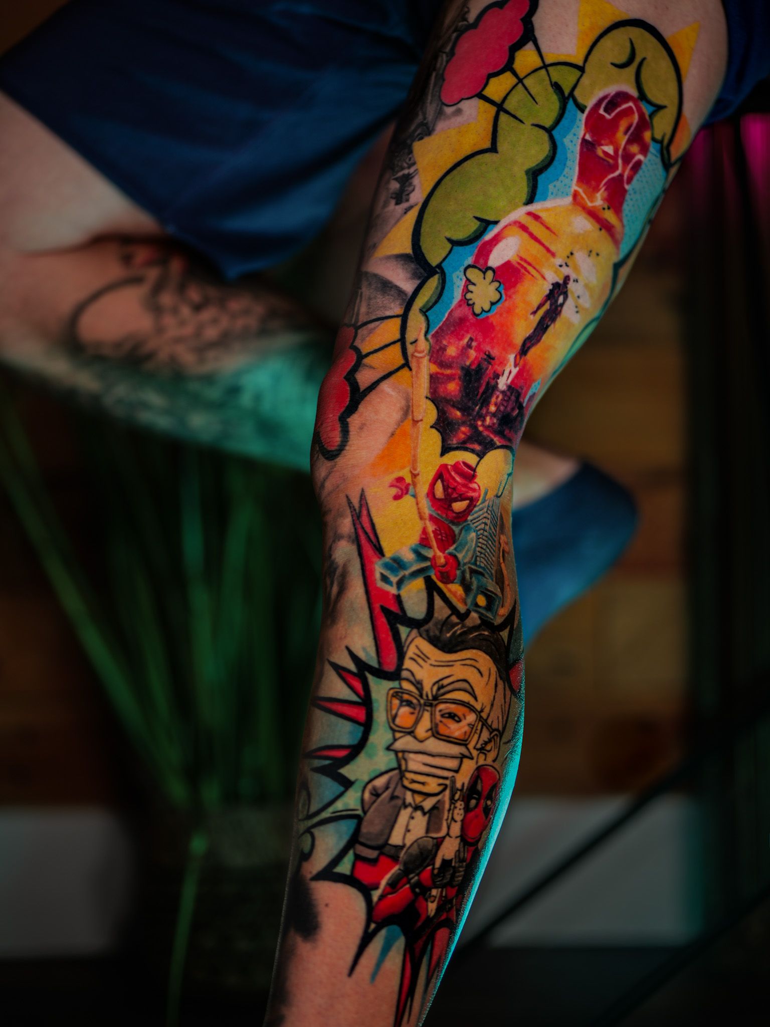 Bold colour cartoon comic leg sleeve tattoo, by Thomas Palaniuk, Aloha Tattoo Studio Gloucester