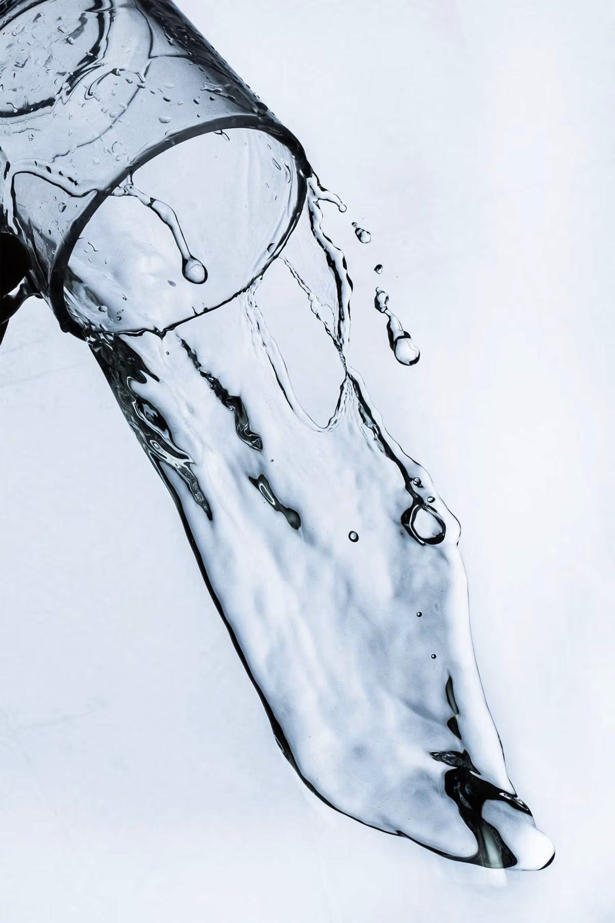 Water pouring from a tipped glass