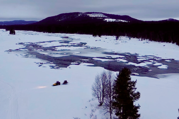 snowmobile ride across the frozen lake to the lavvo