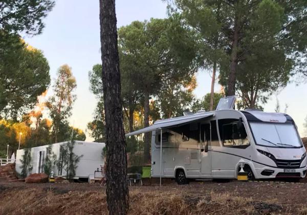 An RV in a forest in Spain