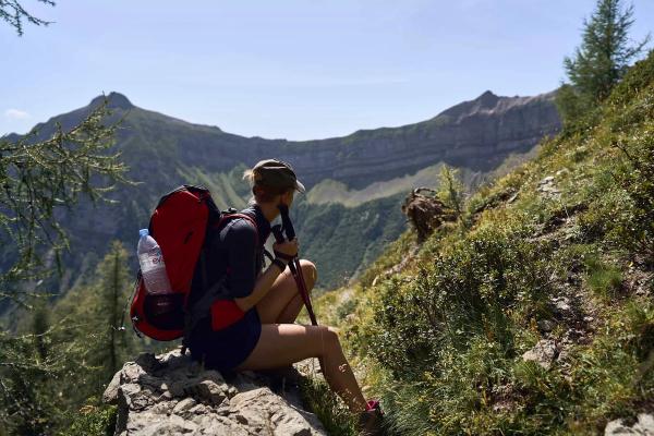A French woman backpacking while camping in France