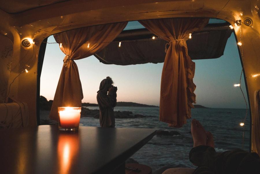Campervan showcasing danish hygge with cosy candles and lights