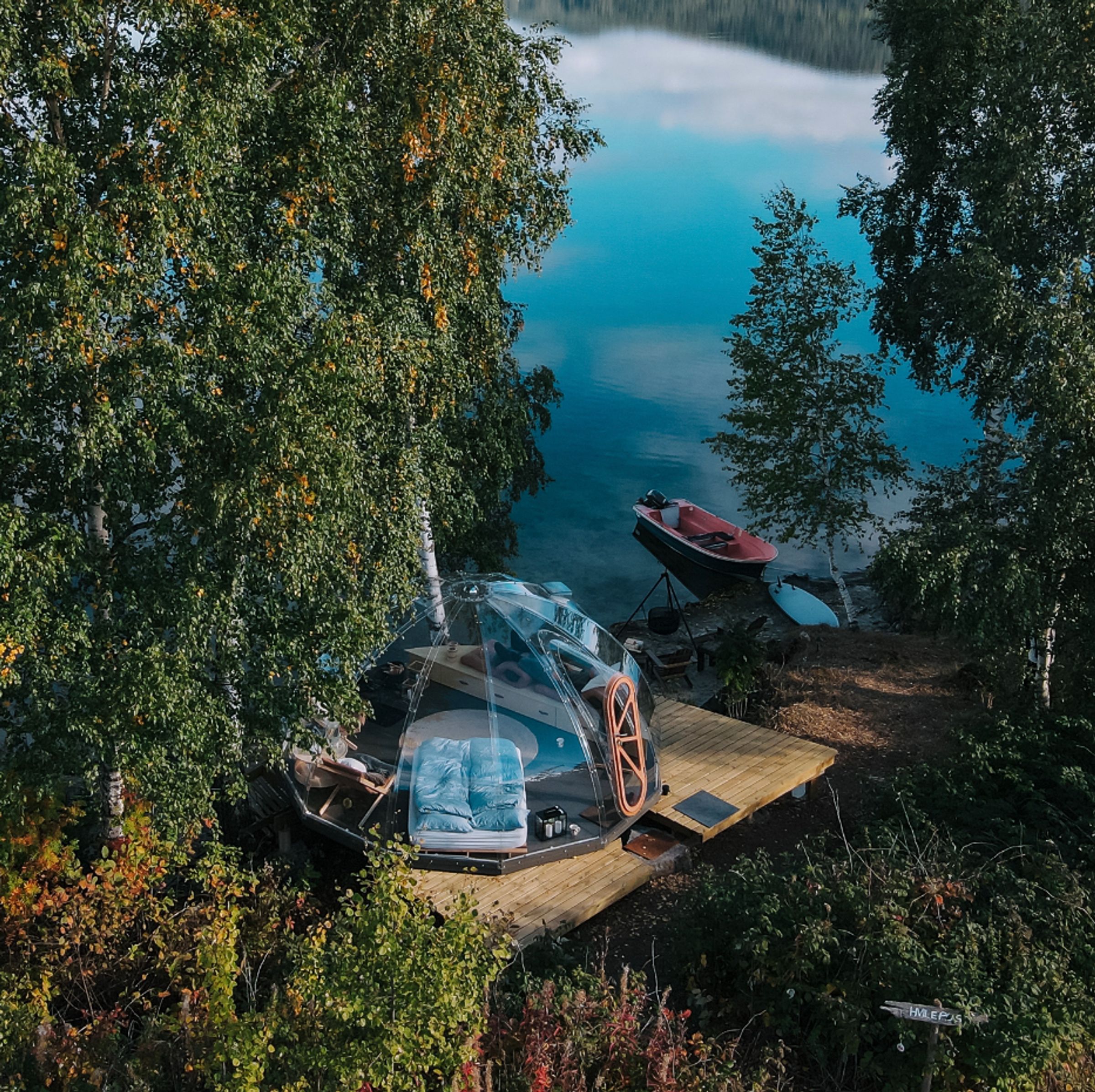 Glass cabin under the summer sky