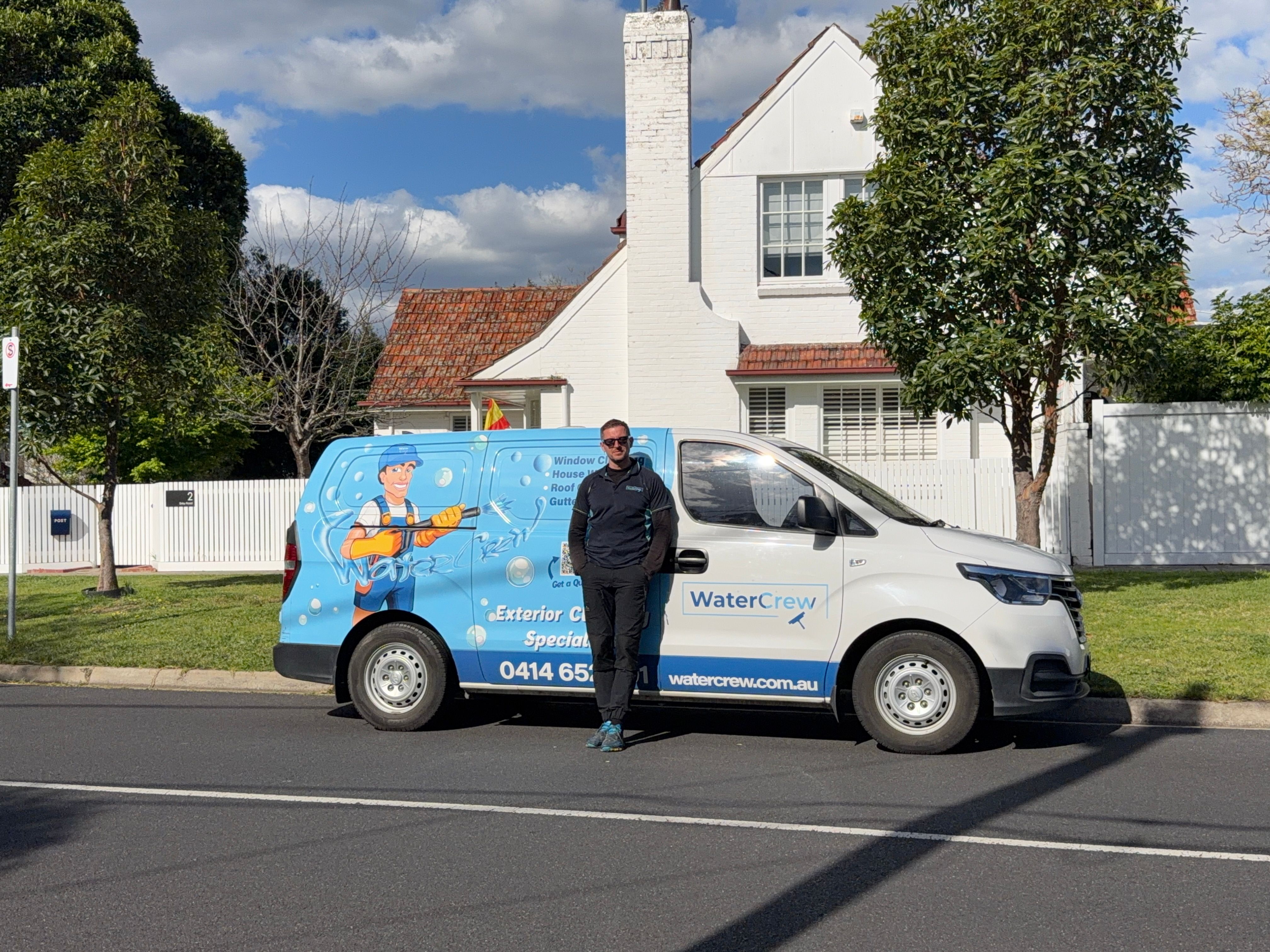 WaterCrew technician outside a 1950s brick and tile house in Hampton East