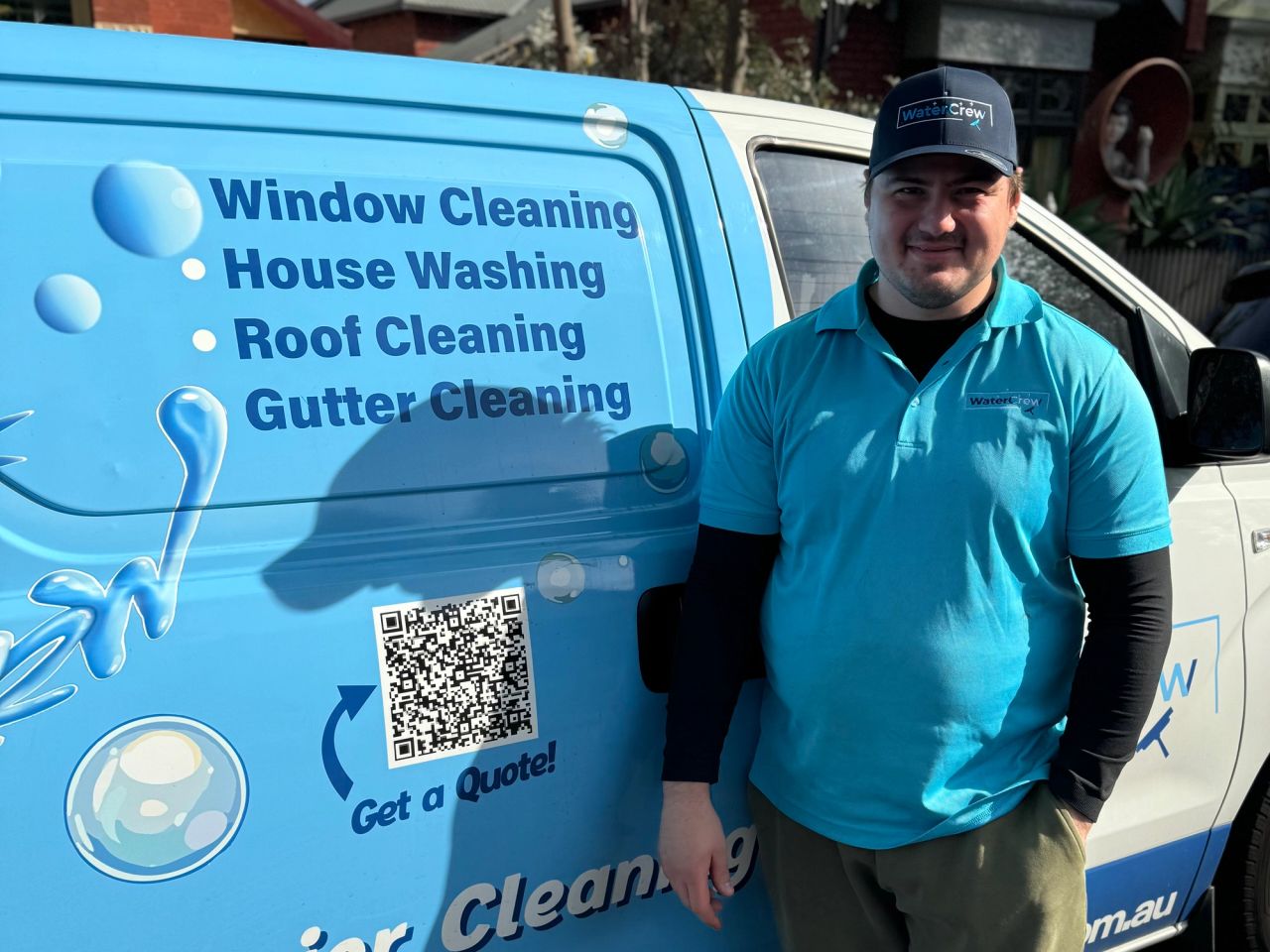 WaterCrew technician beside the signwritten van on a St Kilda East job
