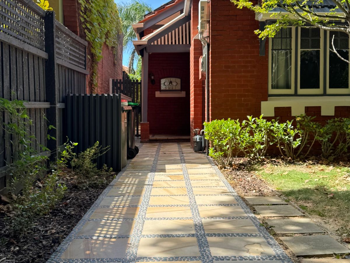 The same Ruskin Street driveway cleaned to an even finish, no pale bands in the wheel tracks