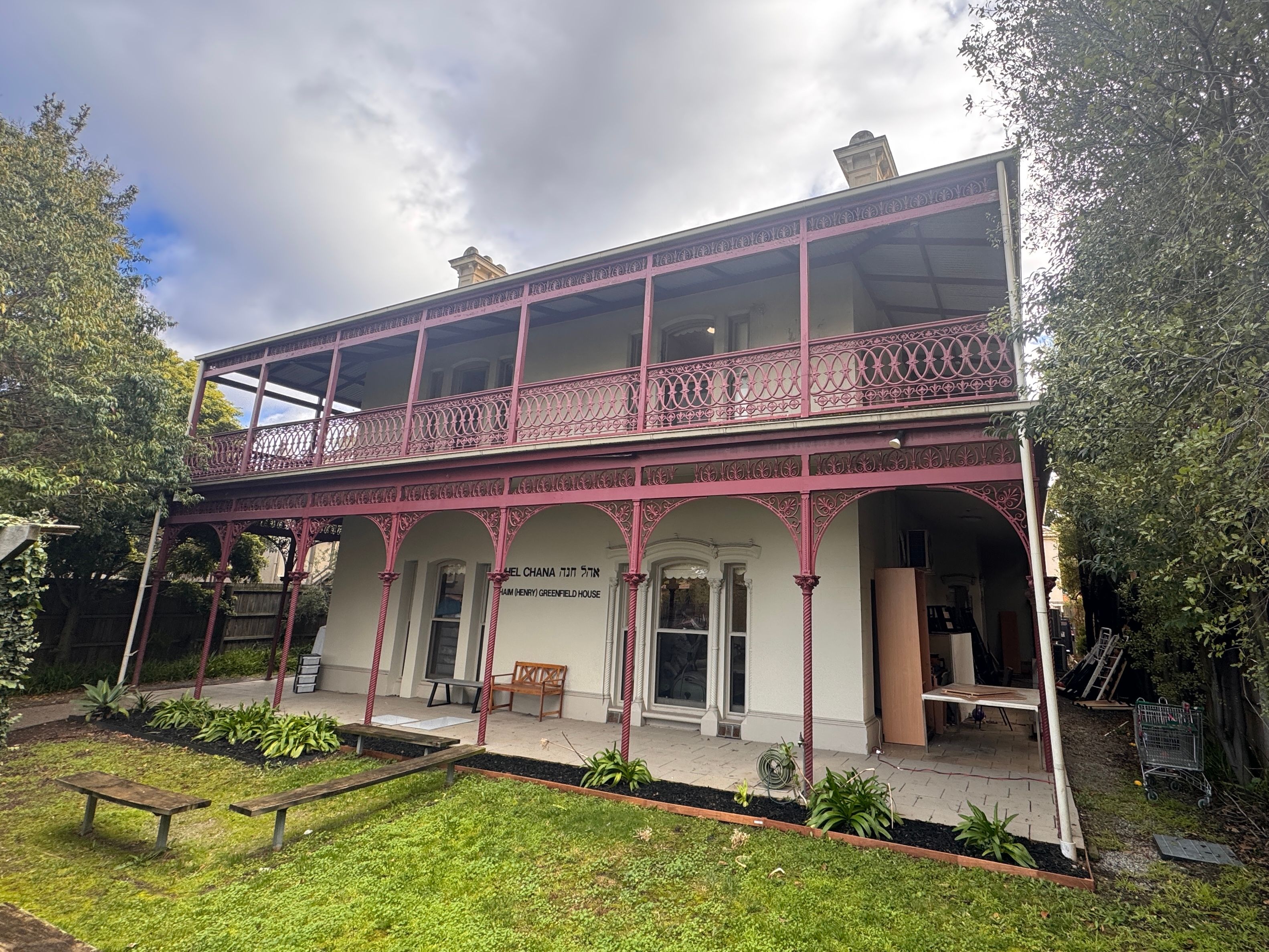 Two-storey Victorian building in St Kilda East with cast-iron lace verandahs