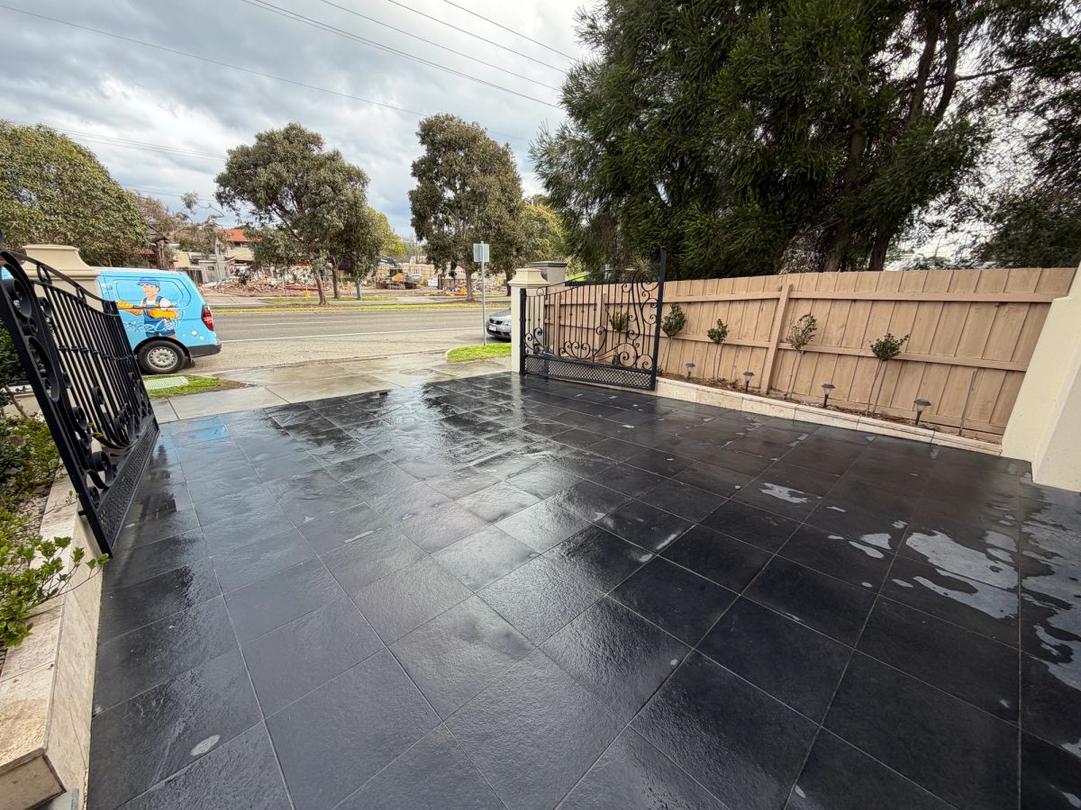 The same South Road driveway after cleaning, even charcoal across every tile