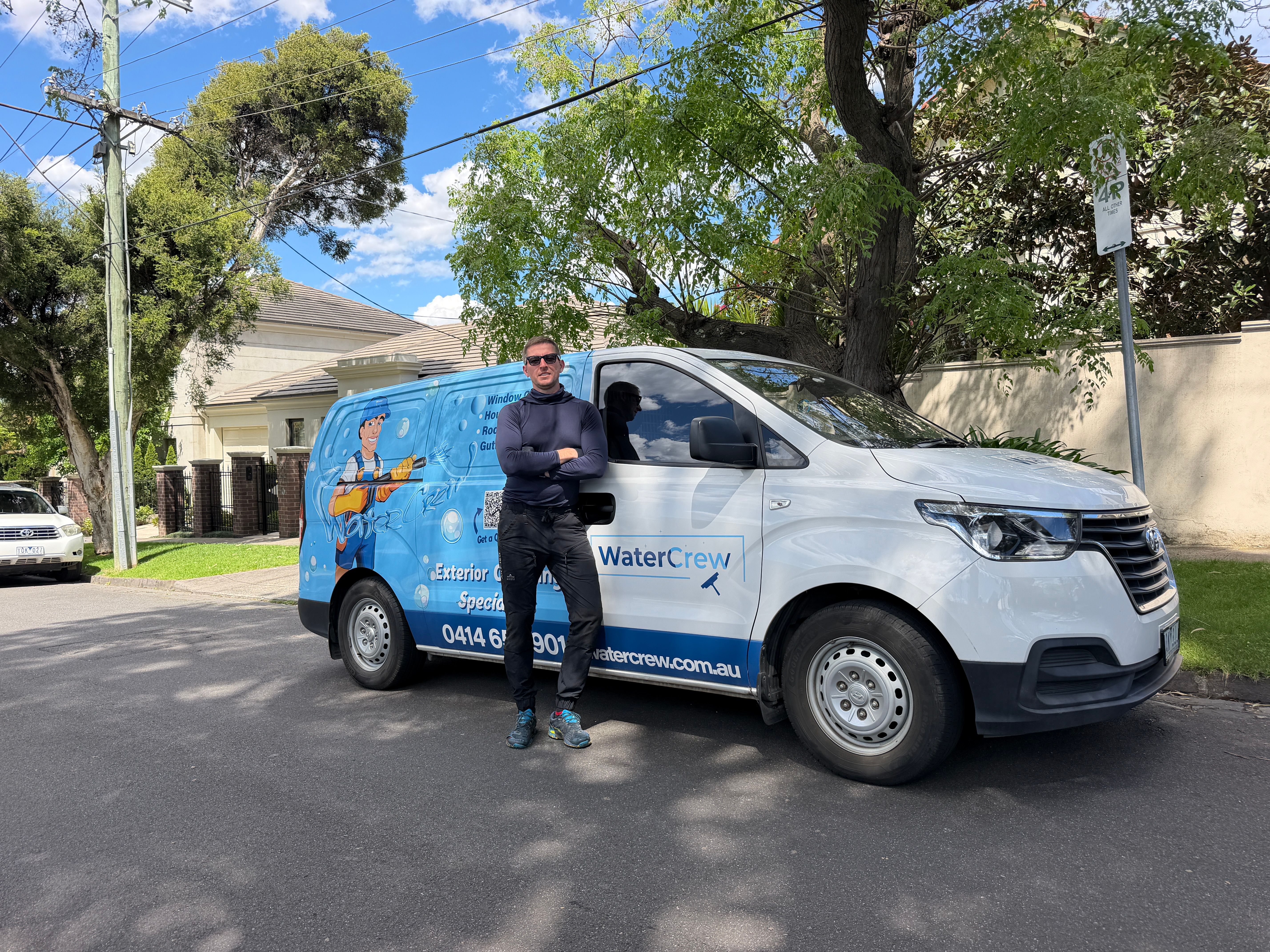 WaterCrew technician working at height on a tall Malvern house frontage