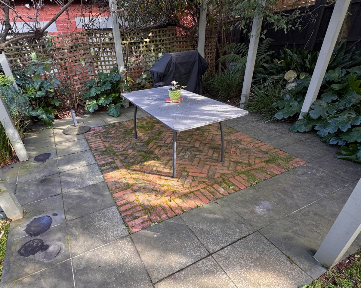 Backyard paving on St Helen's Road, Hawthorn East in mixed bluestone and concrete before cleaning