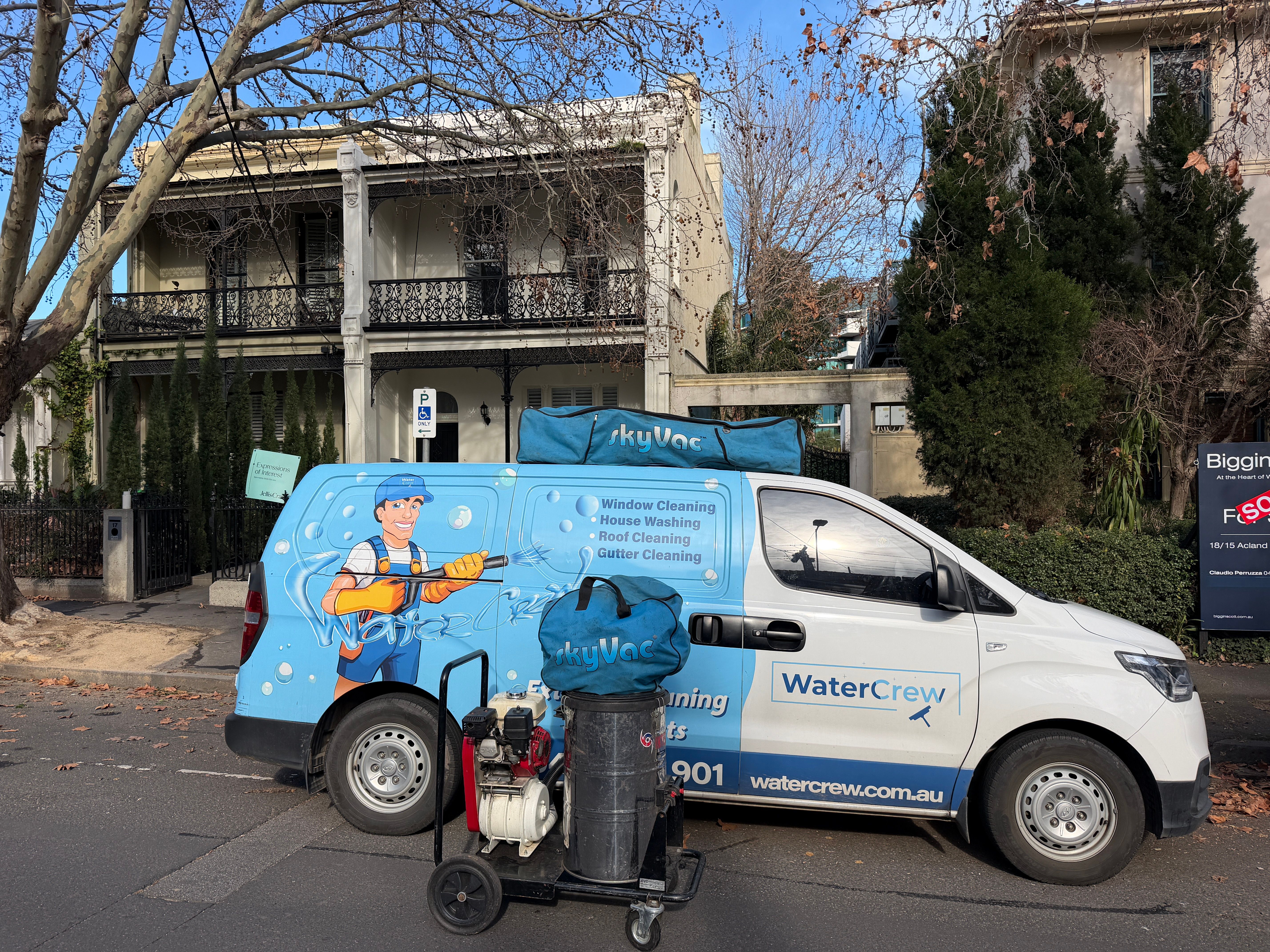 WaterCrew van and SkyVac gutter vacuum outside a Victorian terrace in St Kilda
