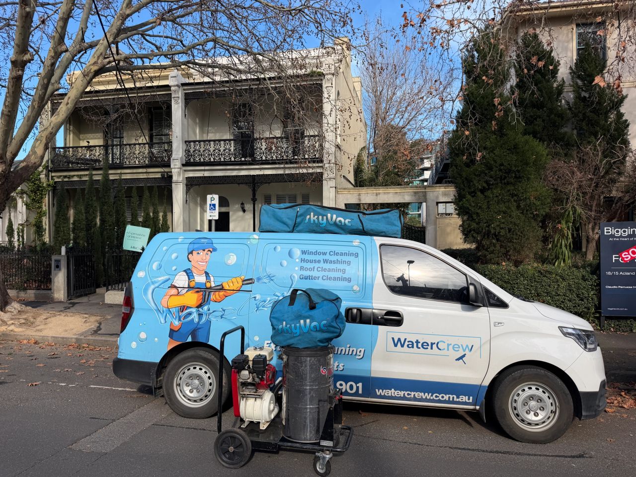 WaterCrew van and SkyVac gutter vacuum outside a Victorian terrace in St Kilda