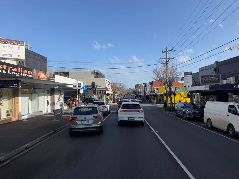 Traffic and shopfronts along Hampton Street, the suburb's main retail strip
