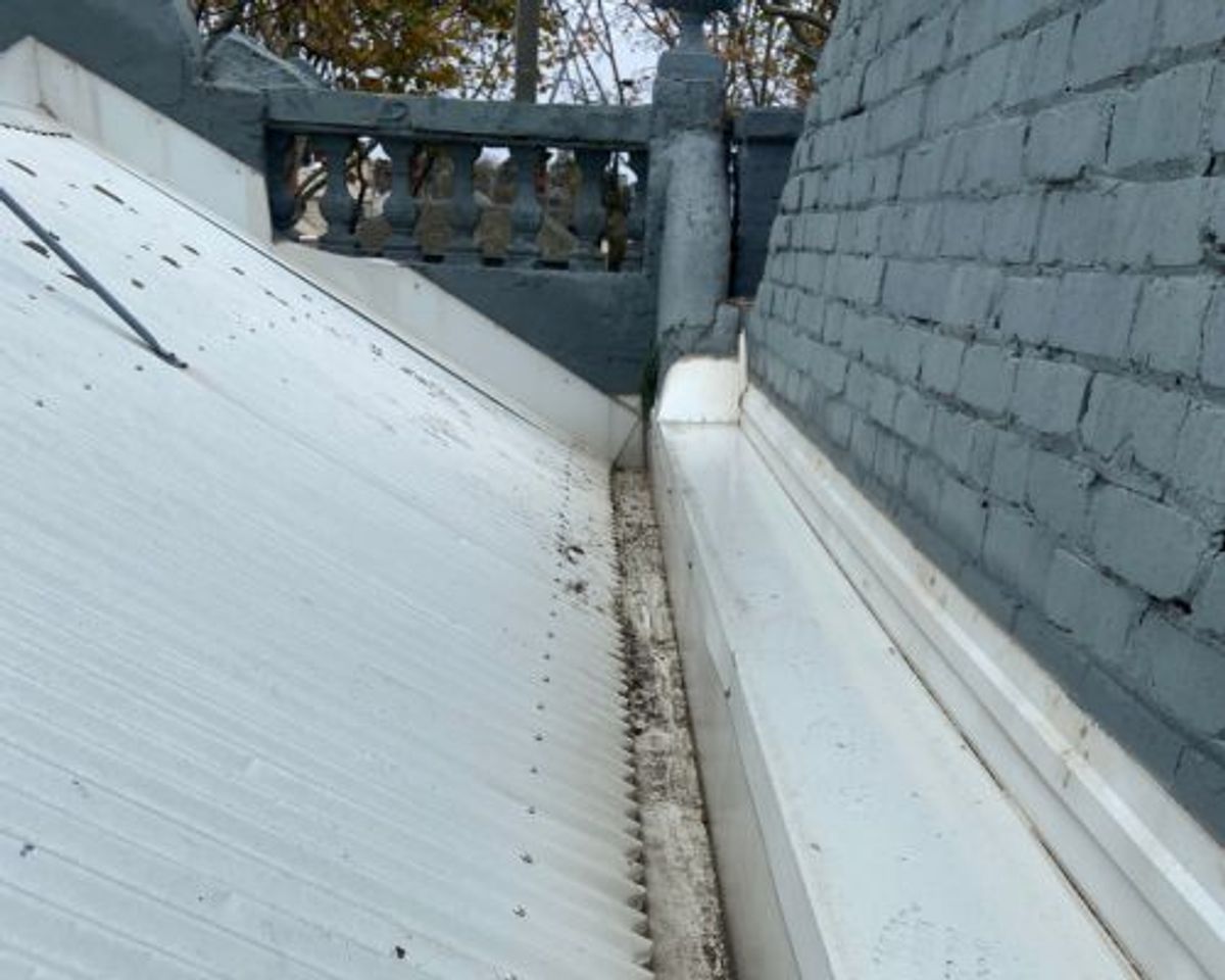 The same Richardson Street box gutter cleared along the roof-to-box join after cleaning