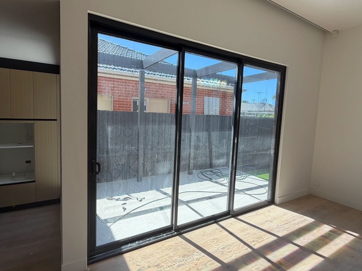 New windows on Kaniva Court, Bentleigh East with label adhesive and construction debris in the sliding channels