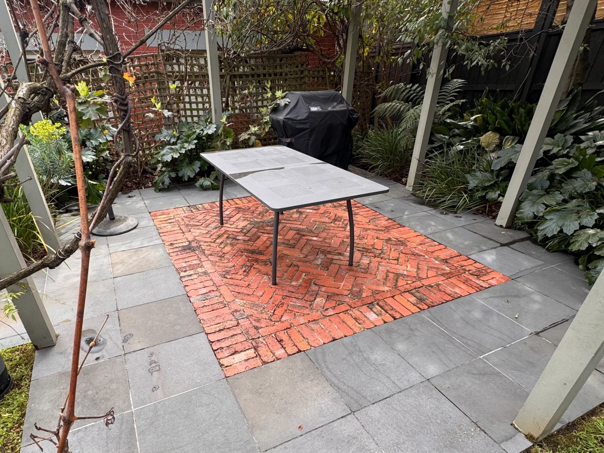 The same St Helen's Road yard cleaned, bluestone and concrete matching in tone