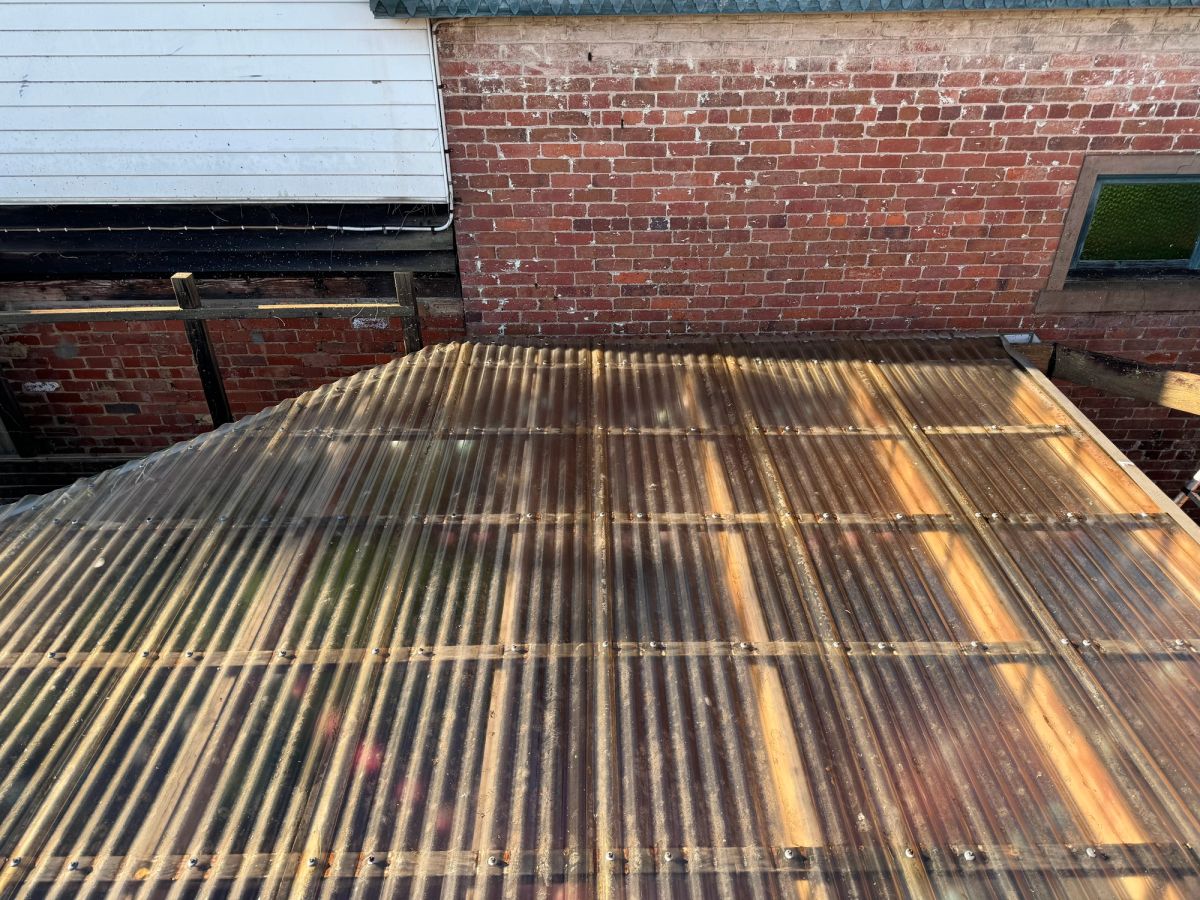 The same Gordon Street pergola sheeting cleared of moss, light coming through clear again