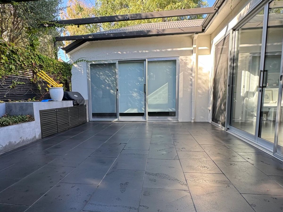 The same Allison Road paving after the resin was lifted, surface colour even and unetched
