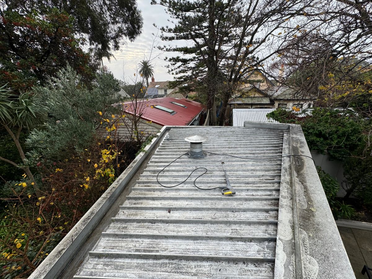 Clear Colorbond gutter and outlet on Sussex Street, Brighton after vacuum cleaning and flow testing