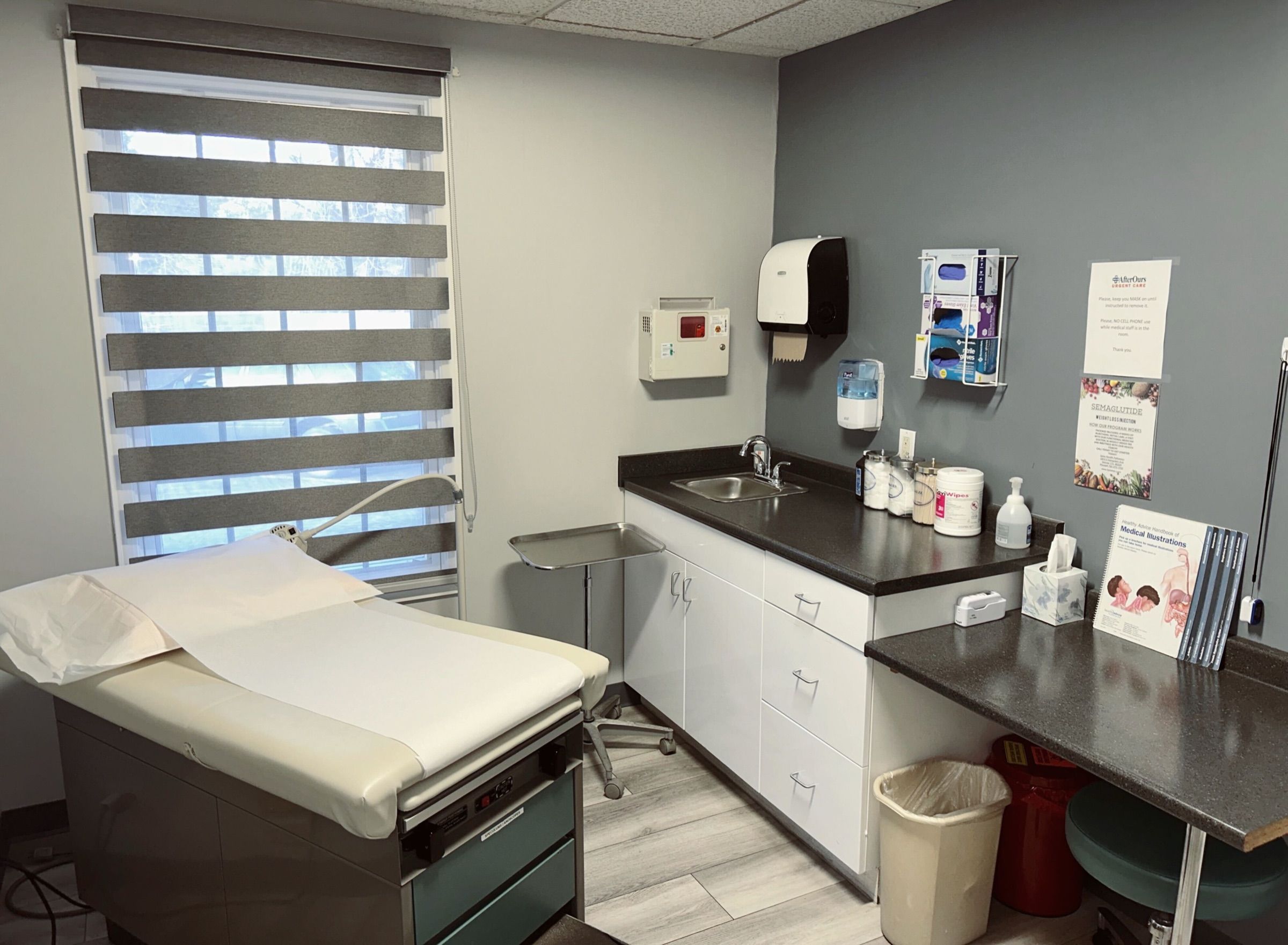 Exam room with an exam table, sink and counter