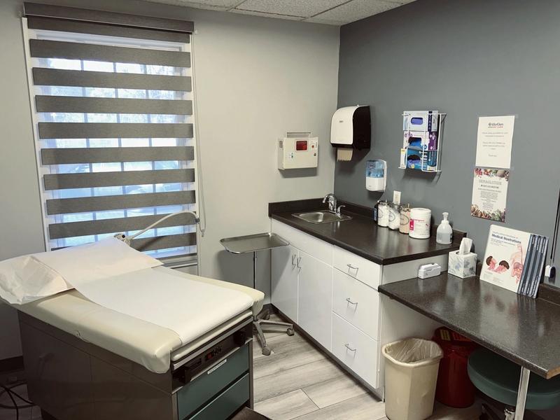 Exam room with an exam table, sink and counter