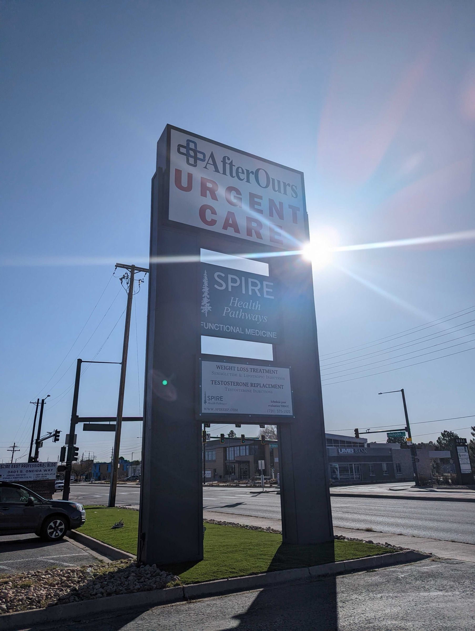 AfterOurs Urgent Care roadside sign in the afternoon sun