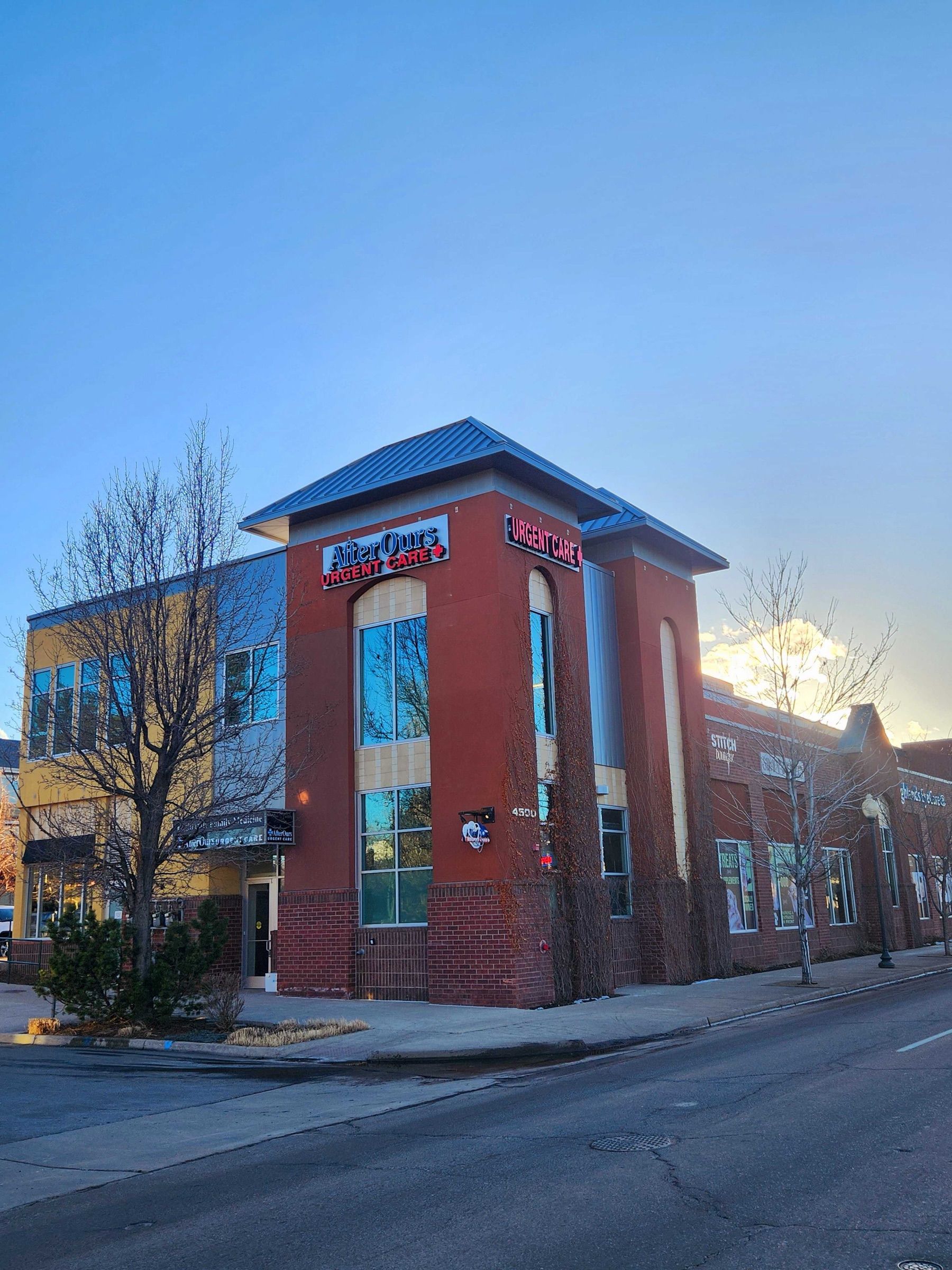 AfterOurs Denver Highlands building at sunset