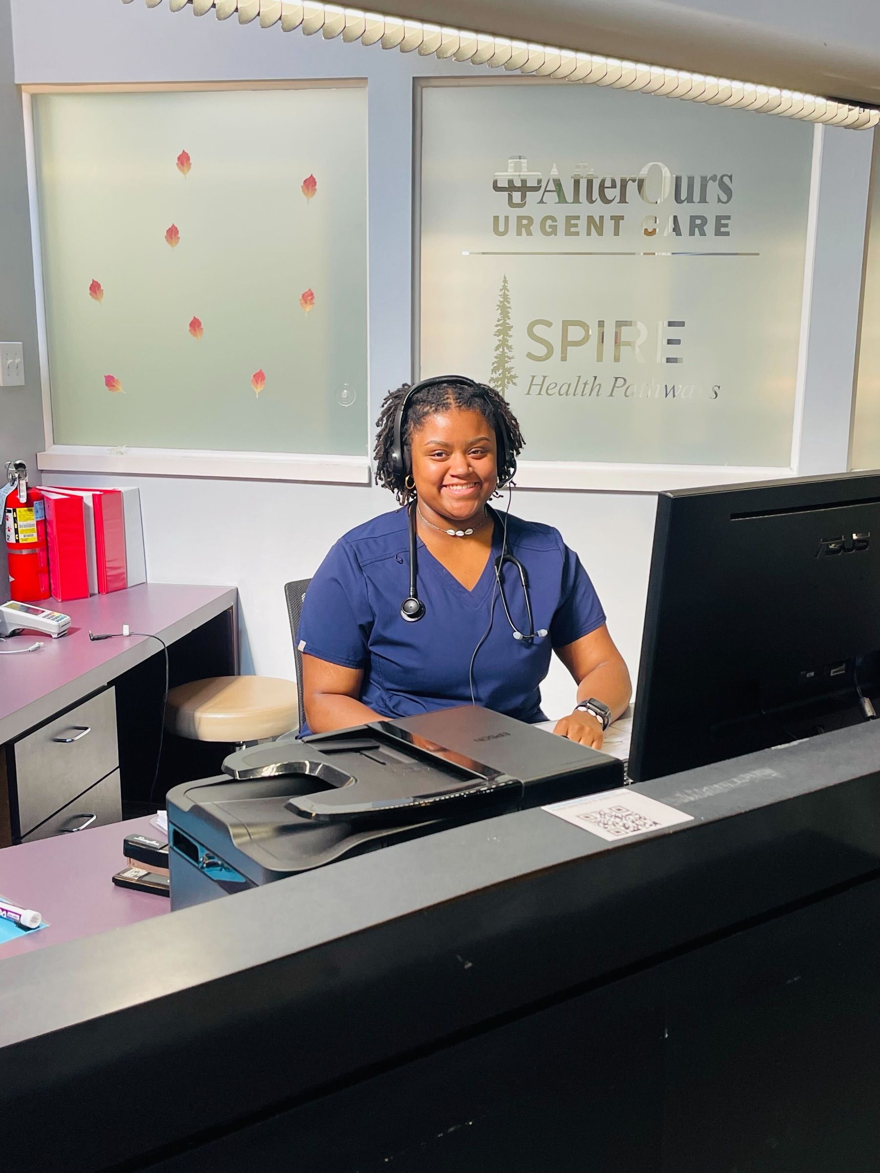 A friendly AfterOurs team member at the front desk in Denver Southeast