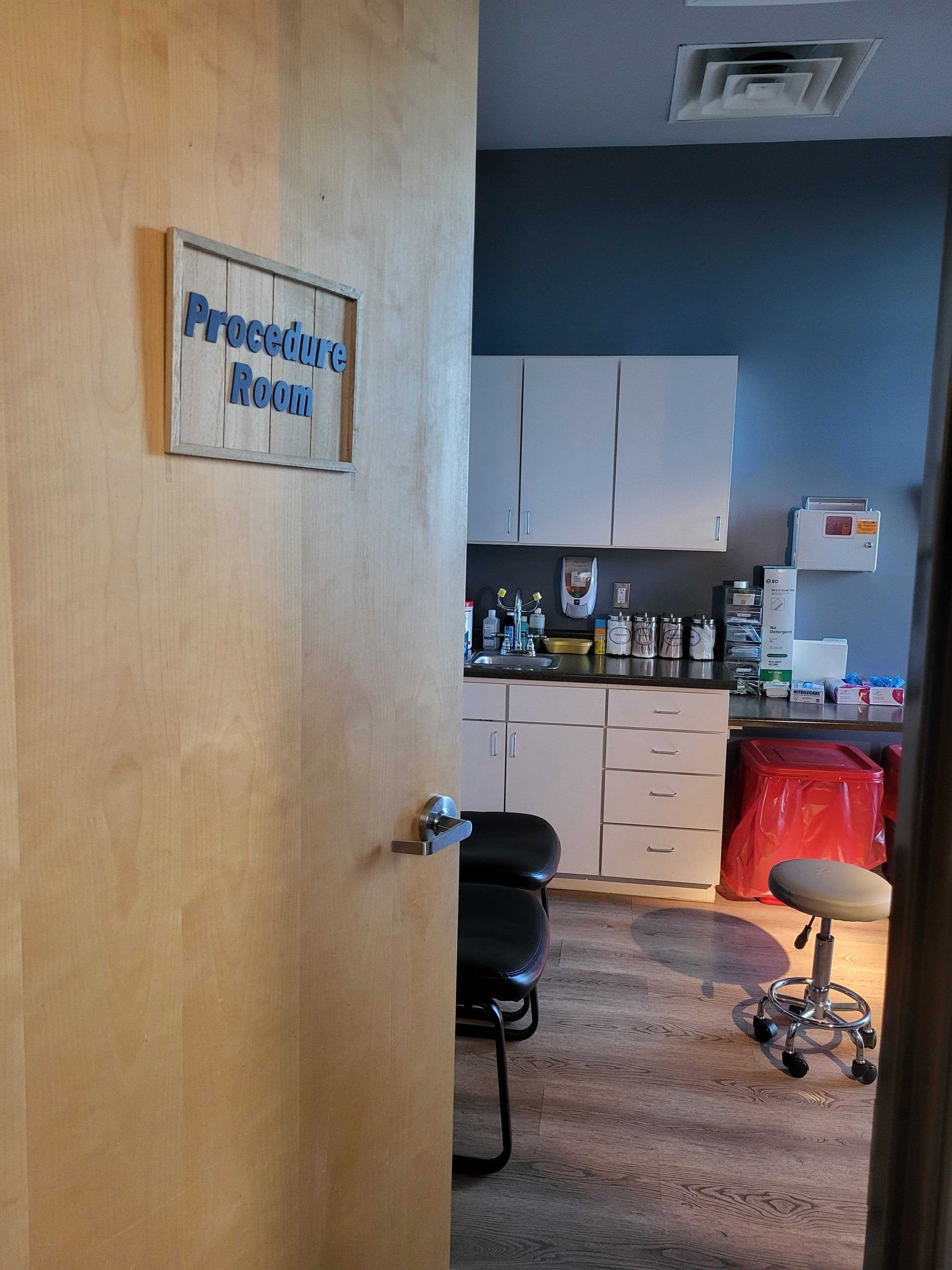 Procedure room with supplies and cabinets