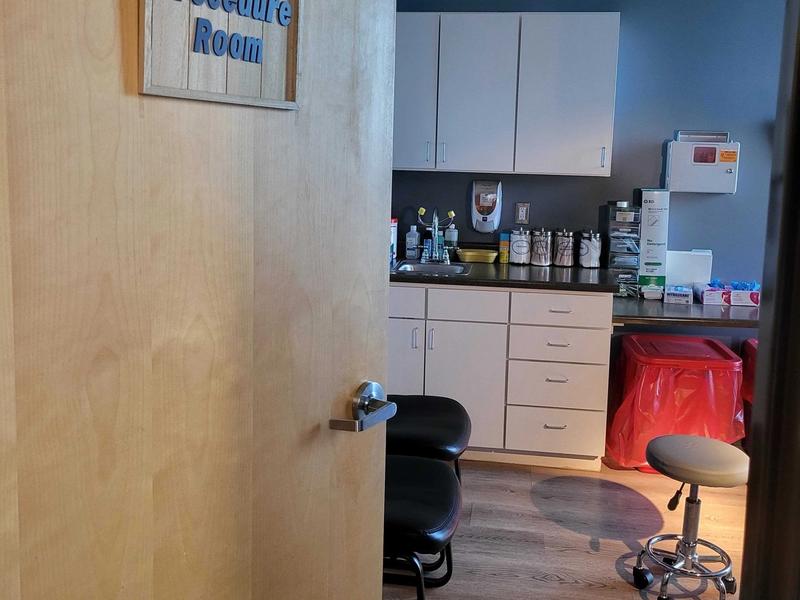 Procedure room with supplies and cabinets